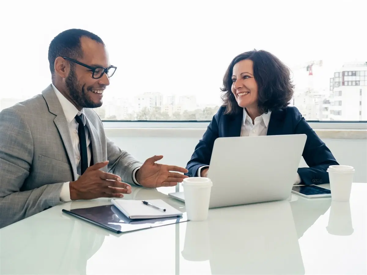 two-people-looking-at-a-computer